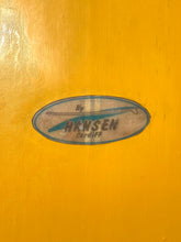 Load image into Gallery viewer, Hansen Cardiff logo on a yellow background