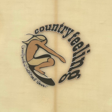 Load image into Gallery viewer, A circular logo featuring a stylized figure in tan and black riding a surfboard, with the words 'country feeling' arched above it, shown on a light beige background.