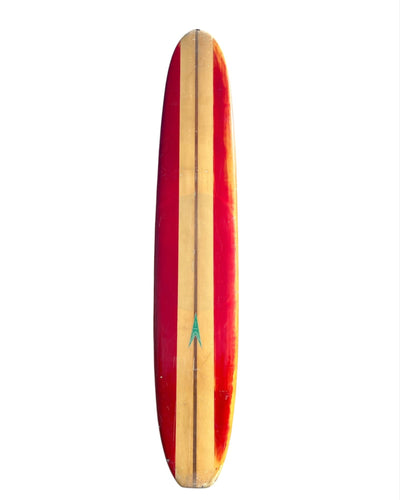 Red and yellow surfboard with a green logo on a white background