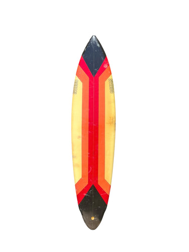 Surfboard with a red, yellow, and black striped design on a white background