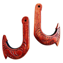 Load image into Gallery viewer, Wooden fish hook with intricate carvings on a white background