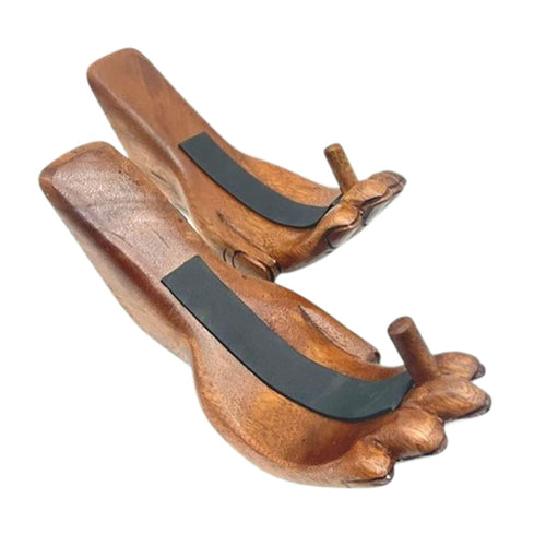 Wooden hand-shaped product with black protection insole on a white background