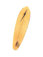 Load image into Gallery viewer, A vintage surfboard in a warm golden-yellow color, featuring a black lightning bolt graphic near the nose and a red tail fin accent, isolated on a white background.