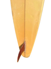 Load image into Gallery viewer, Close-up of the tail section of a translucent yellow surfboard, showing the fin and red tail fin against a plain white background.
