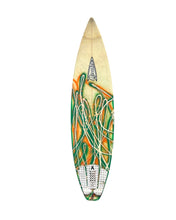 Load image into Gallery viewer, A surfboard with a cream-colored nose, green and orange abstract graphics, and a white traction pad at the tail, shown against a plain white background.