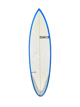 Load image into Gallery viewer, A long surfboard shown upright against a plain white background, with a white deck, blue edge trim, and small printed branding near the center and lower section.