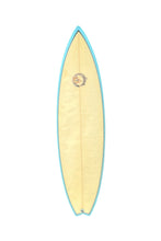 Load image into Gallery viewer, A Hawaiian Bernhardt surfboard with a pale yellow body, a light blue edge trim, and a central circular logo, shown against a plain white background.