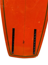 Load image into Gallery viewer, Close-up of the tail section of an orange surfboard with black fin boxes and a thin dark outline, shown against a white background
