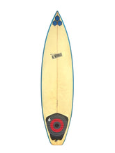 Load image into Gallery viewer, A top-down view of a surfboard with a pale yellow body, a blue edge, a black and red tail pad, and a small black logo near the nose, shown on a plain white background.