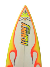 Load image into Gallery viewer, A close-up of a surfboard nose section featuring a white base with vibrant yellow and orange flame graphics, and the 'KUNNY DESIGNS' logo printed vertically in yellow, orange, and black.
