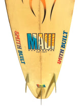 Load image into Gallery viewer, A vintage cream-colored surfboard with 'MAUI SURFBOARDS' and 'SMITH BUILT' graphics, shown upside down against a white background.