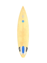 Load image into Gallery viewer, A IG surfboard shown from a top-down view on a solid white background, featuring a blue and black footpad and a small blue and pink sticker near the nose.