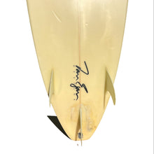 Load image into Gallery viewer, A vintage cream-colored surfboard shown from the underside, featuring a black autograph and a black fin, isolated on a white background.