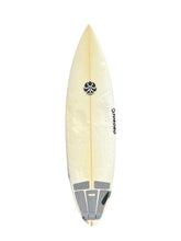 Load image into Gallery viewer, A cream-colored surfboard with a black circular logo and the brand name 'Tokoro' printed vertically on the side, shown against a plain white background.