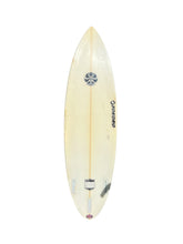 Load image into Gallery viewer, A used surfboard shown from the top deck, featuring a cream-colored fiberglass body, a light wood center string, a black 'Tokoro' logo, and finboxes, isolated on a white background.