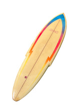Load image into Gallery viewer, A vintage surfboard with a natural light grain base and vibrant painted graphics in blue, red, orange, and yellow, shown on a plain white background.