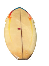 Load image into Gallery viewer, A vintage surfboard with a natural light finish, featuring painted yellow and orange lightning bolt designs on the sides, a blue stripe at the nose, and a red center fin attachment point, shown on a white background.
