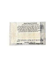 Load image into Gallery viewer, A vintage instruction card with black printed text on aged, off-white paper, detailing how to apply adhesive to an inside window. The card is labeled 'INSTRUCTIONS' and shows 'BAXTER LANE CO.