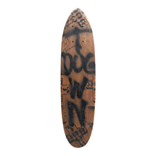 Load image into Gallery viewer, A long, narrow wooden board with rounded ends, featuring black graffiti-style lettering and graphic markings on a natural wood background, isolated on a white background.