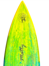 Load image into Gallery viewer, Close-up of the nose of a surfboard with a bright yellow and neon green marbled finish, featuring a circular logo near the tip and the name 'Mattty' in black script.