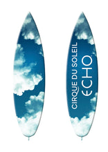 Load image into Gallery viewer, Surfboard with Cirque du Soleil Echo design on a blue sky and cloud pattern
