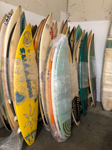 packing used surfboards